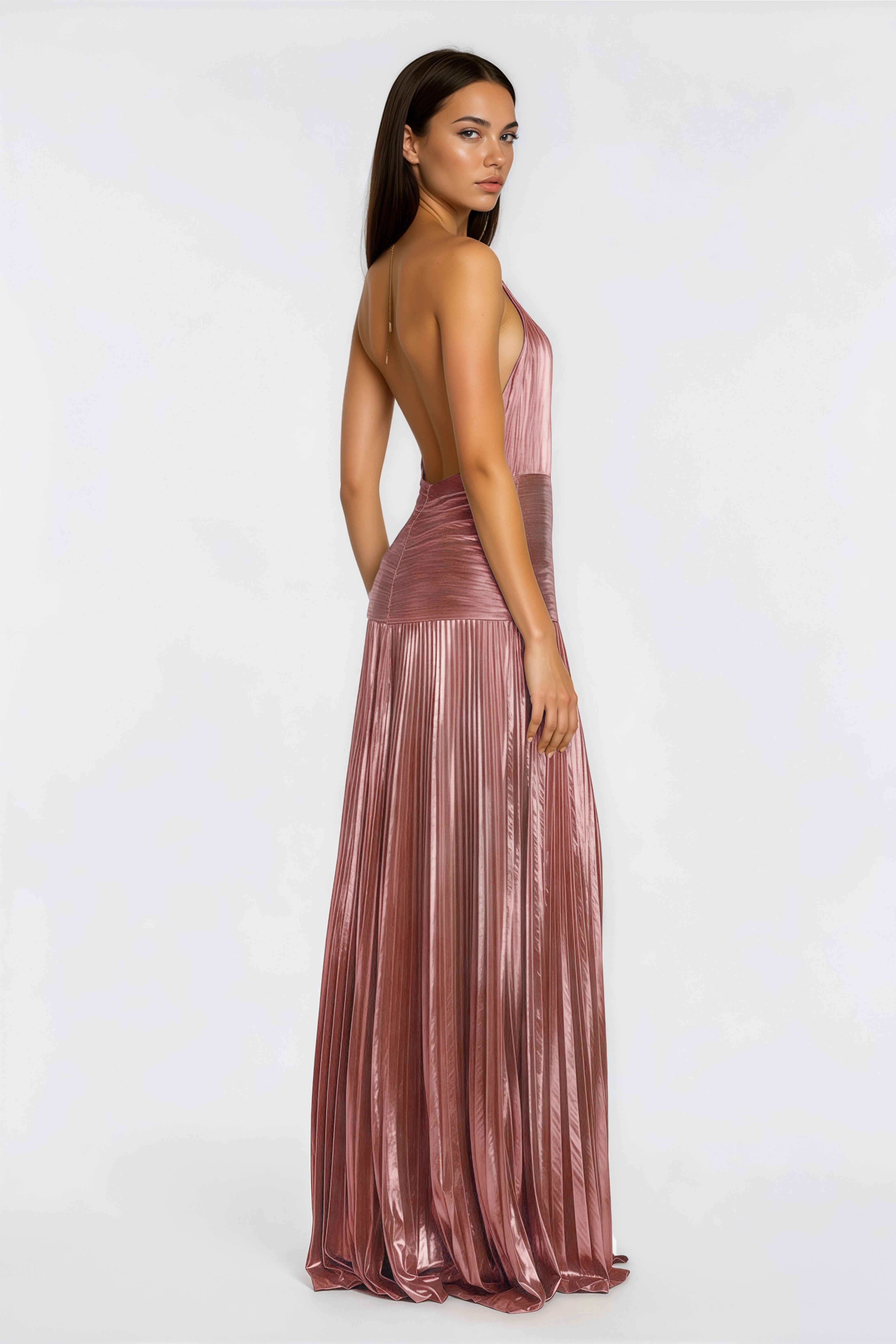 Metallic rose pink pleat halter gown with a cinched waist and high leg slit