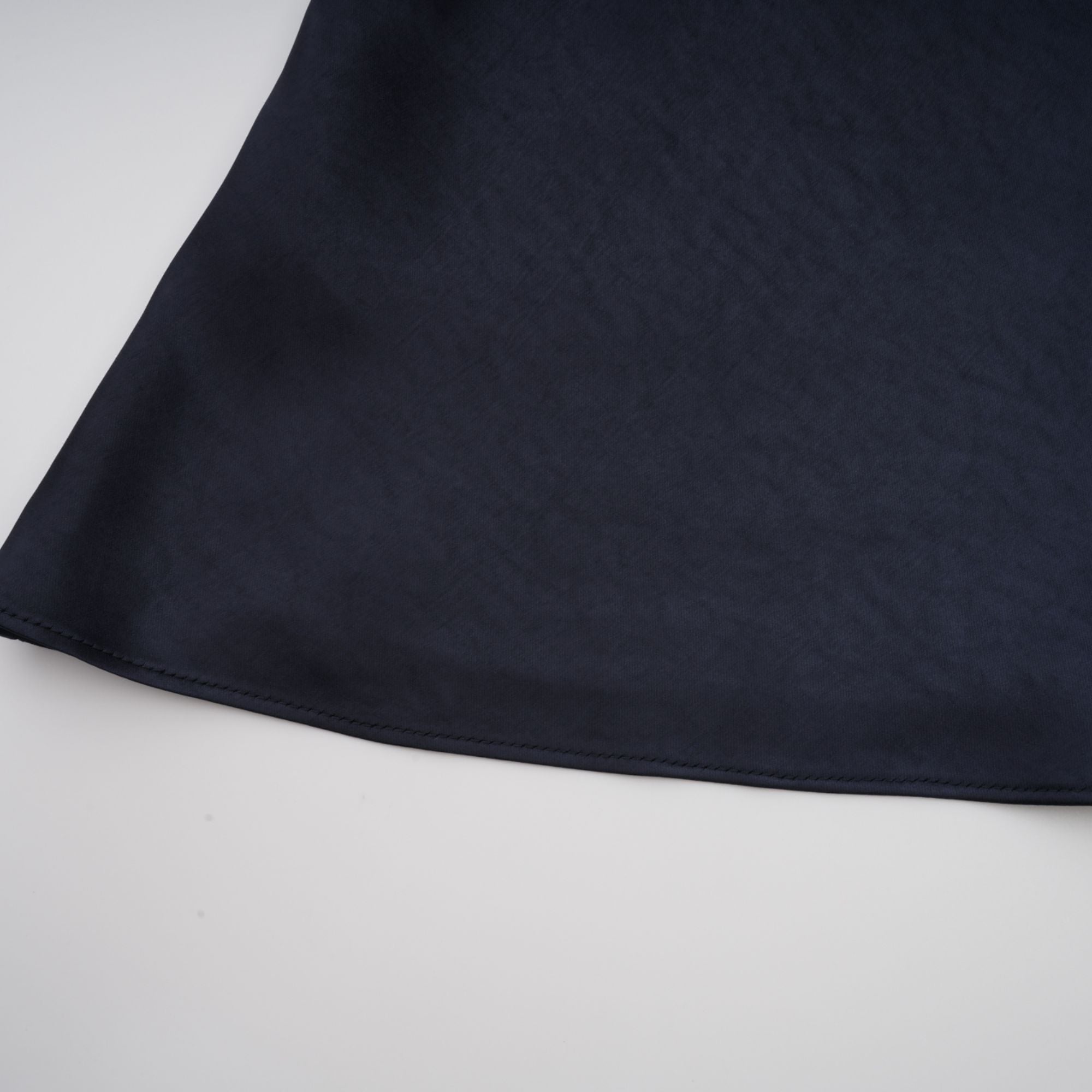 Navy blue short-sleeve maxi dress with a peplum jacket bodice and satin skirt