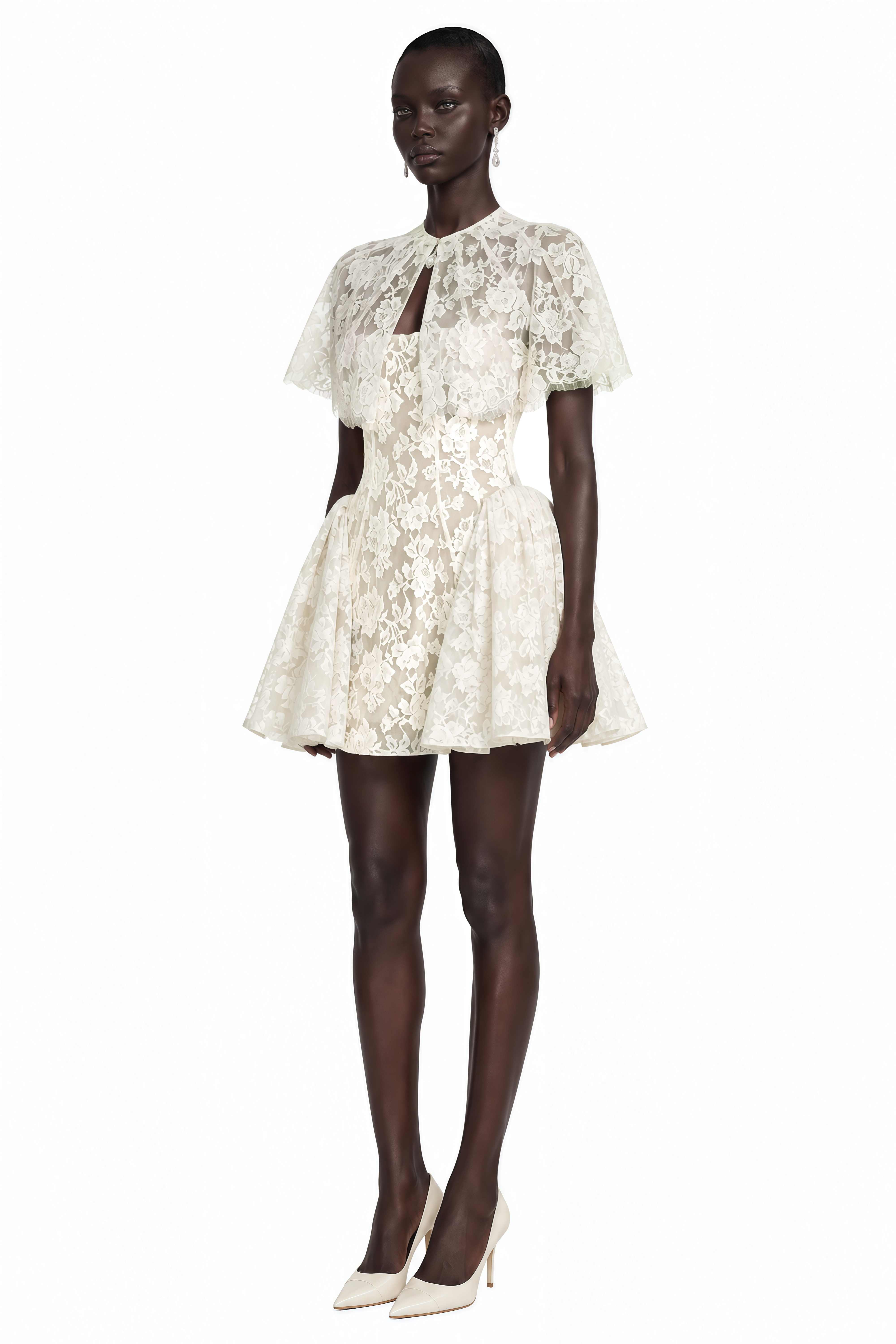 White lace mini dress with a structured flared skirt, keyhole neckline, and short flutter cape sleeves