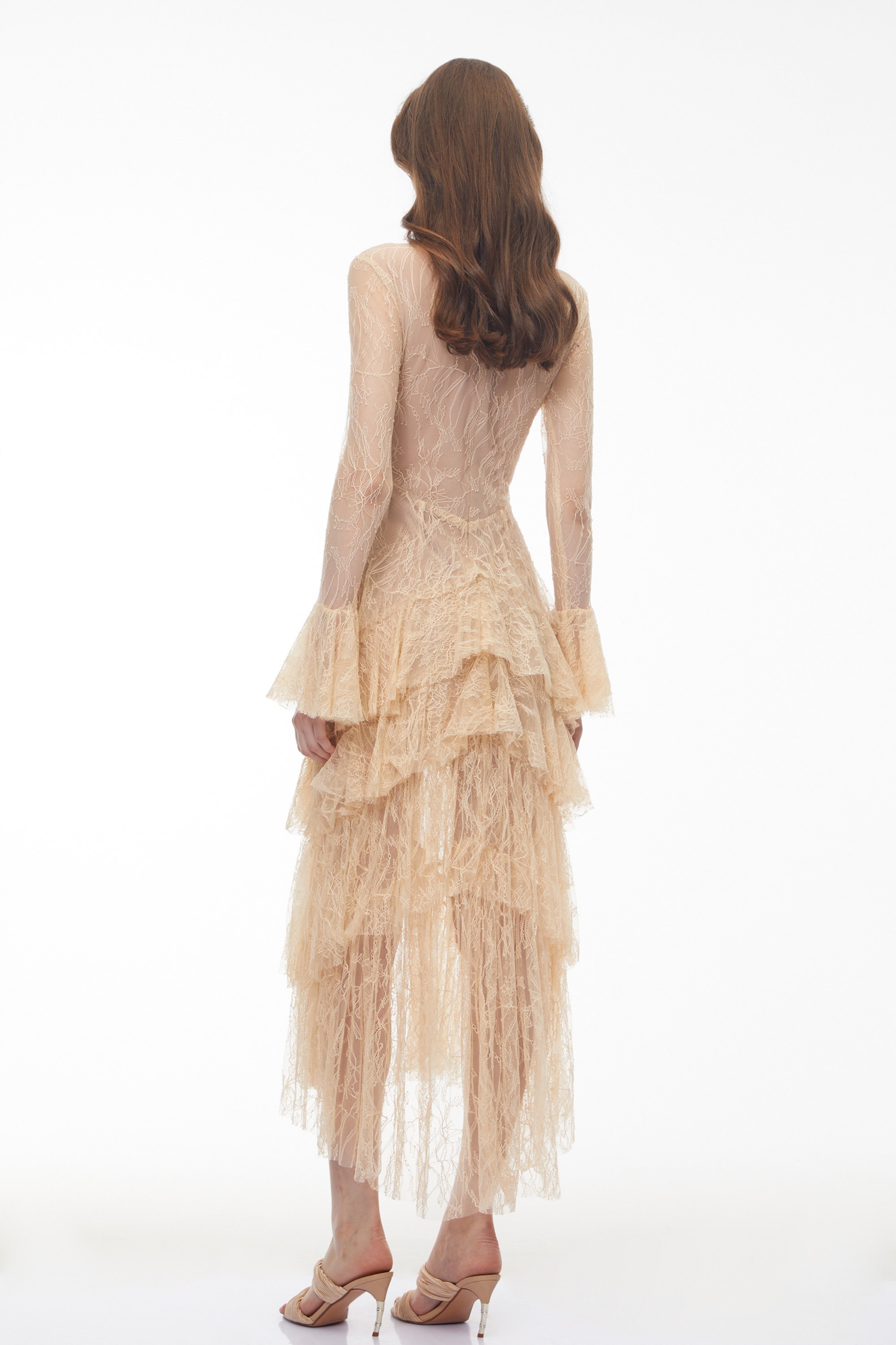 Beige lace gown with a tiered ruffled skirt