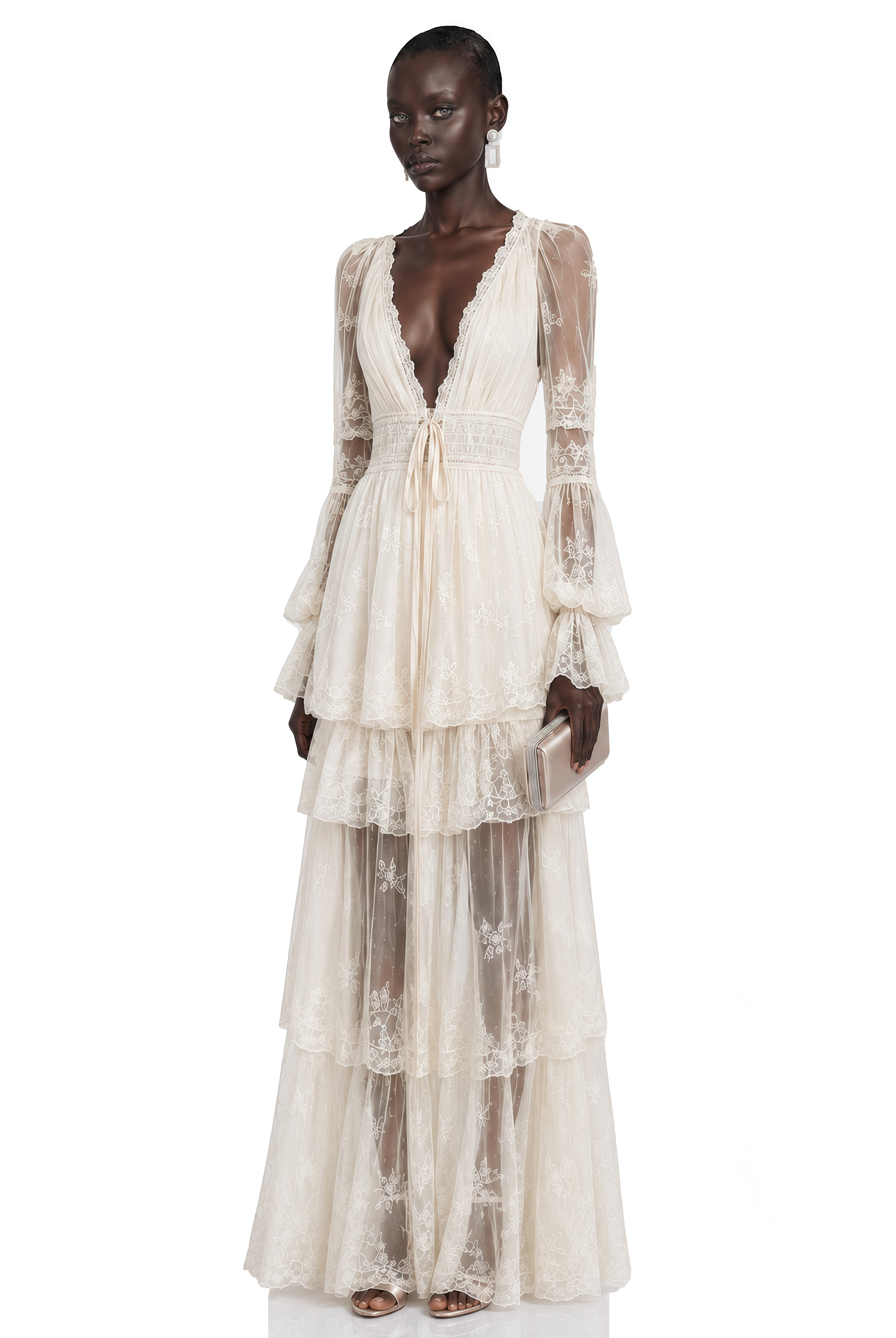 Ivory lace maxi dress with a deep V-neck, long sheer sleeves, and a tiered skirt