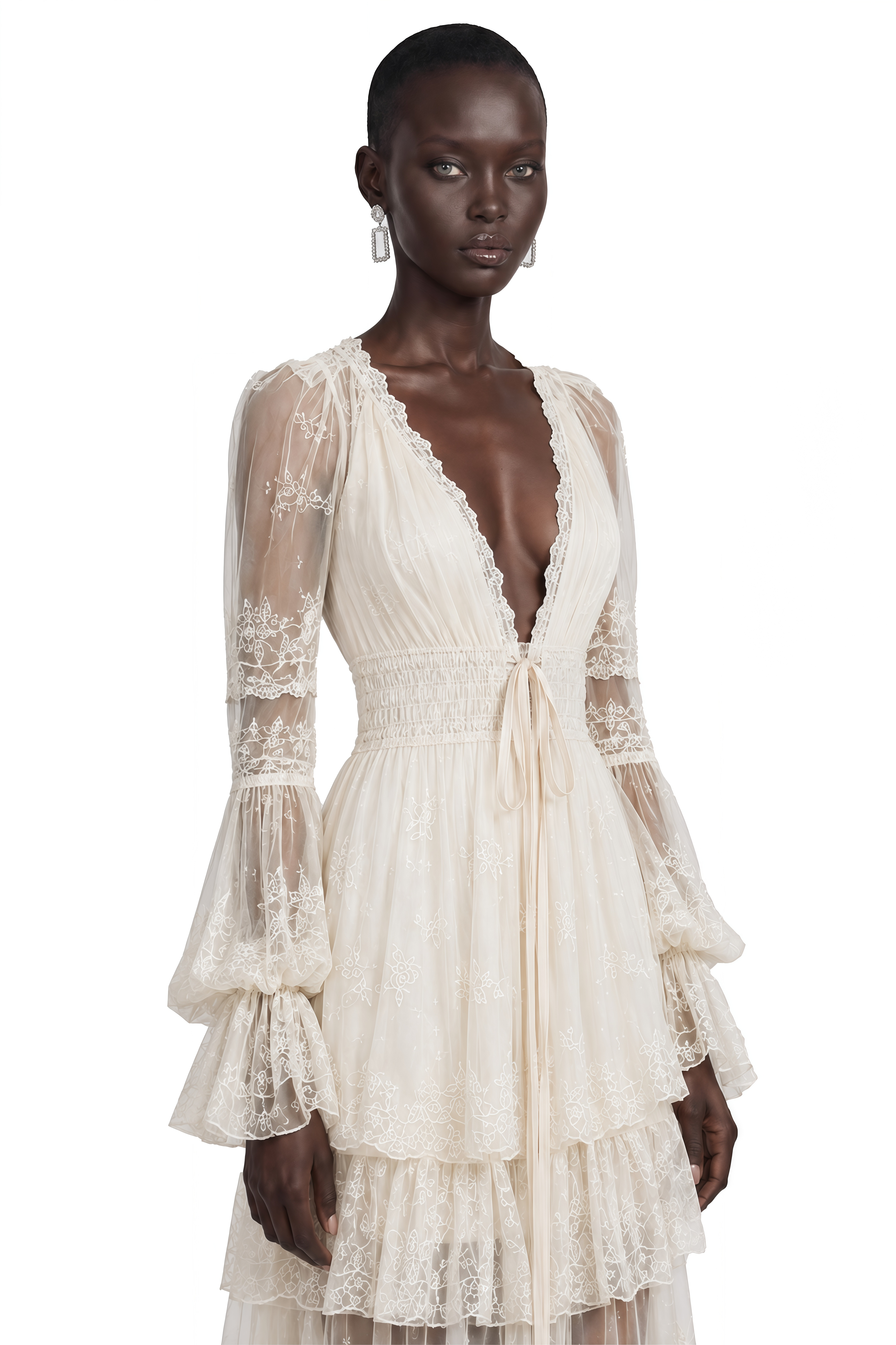 Ivory lace maxi dress with a deep V-neck, long sheer sleeves, and a tiered skirt