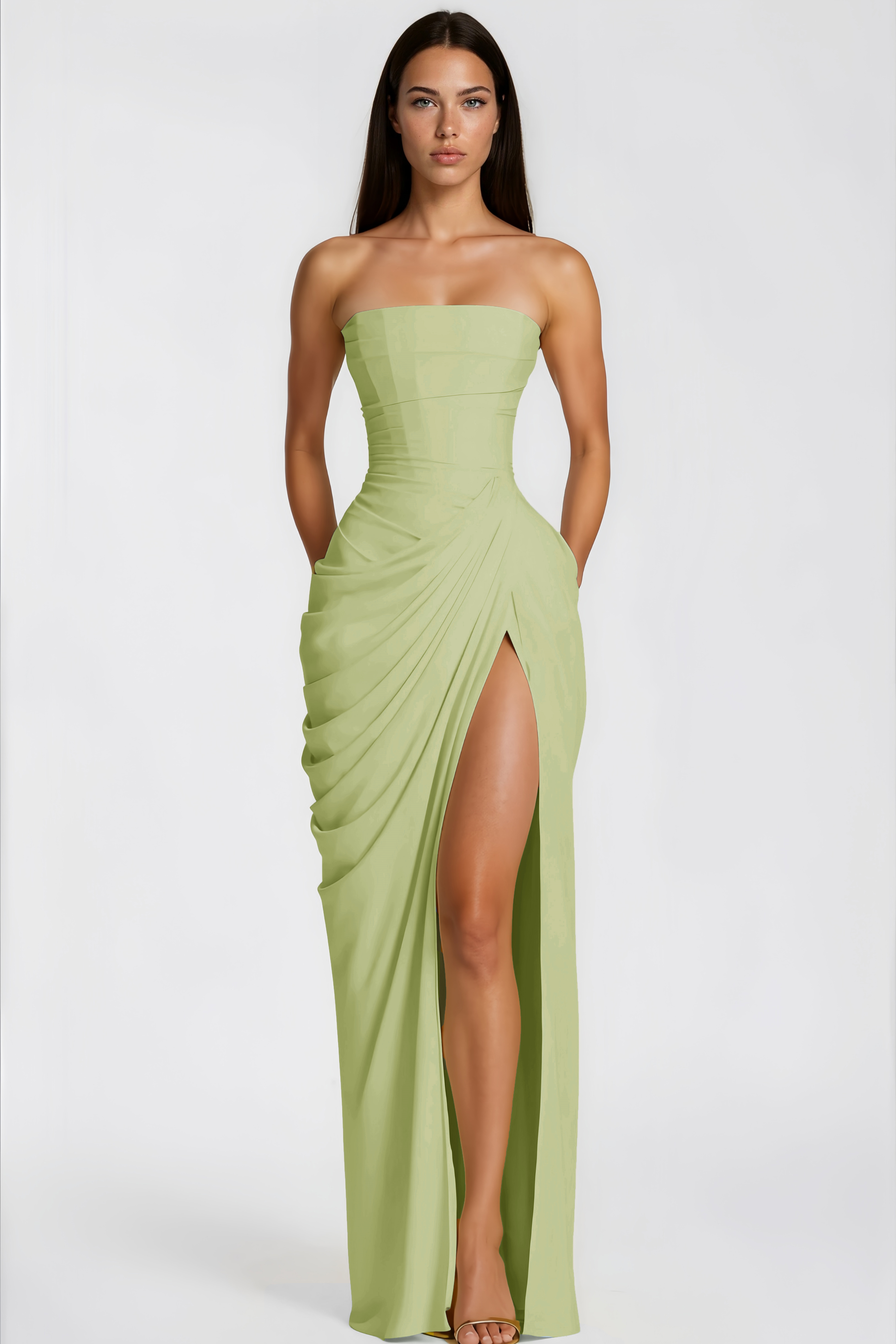 Sage green strapless maxi dress featuring a structured bodice and a draped wrap skirt with a high slit