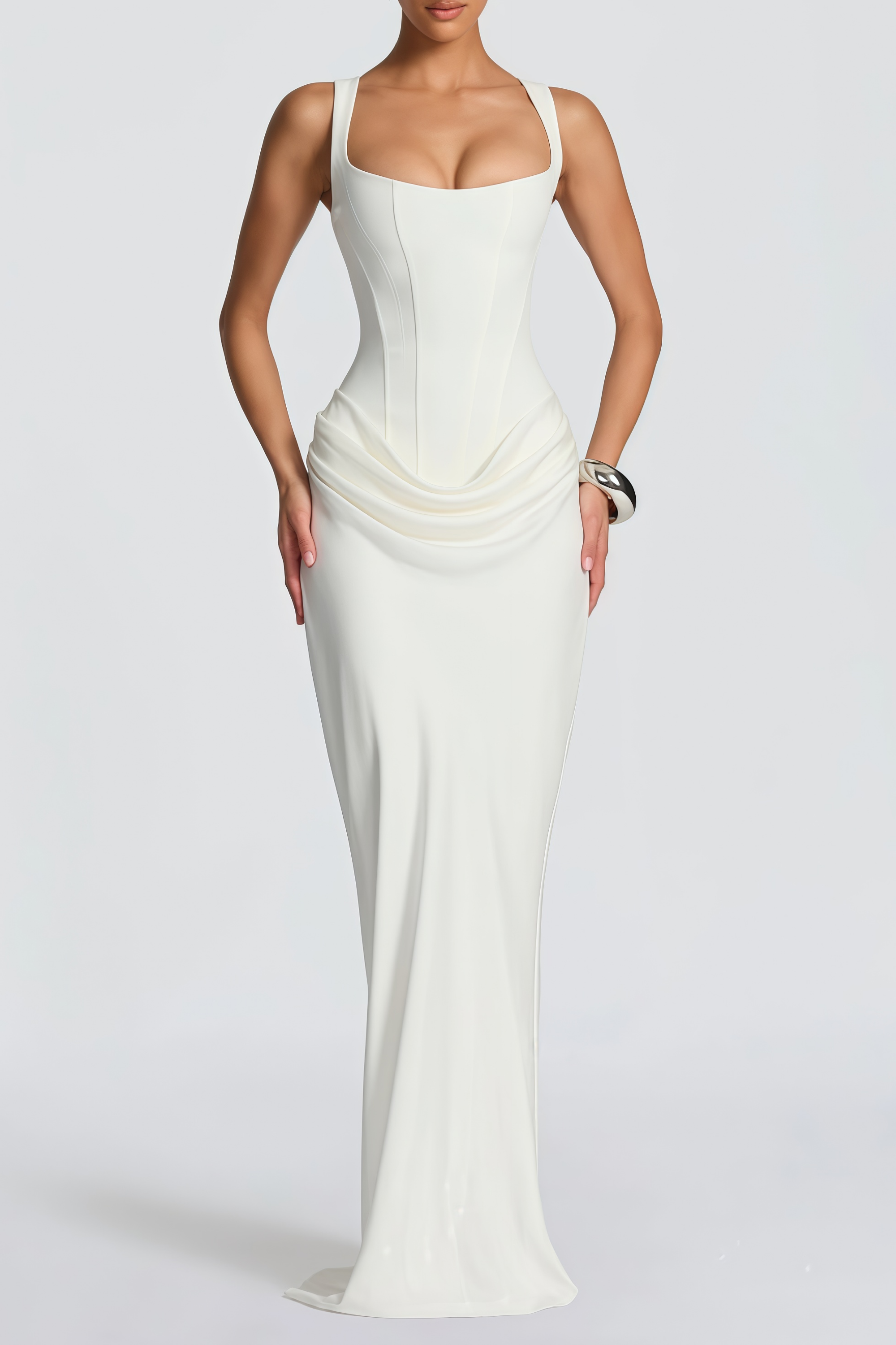 White sleeveless maxi dress with a corset-style bodice and draped hip detailing