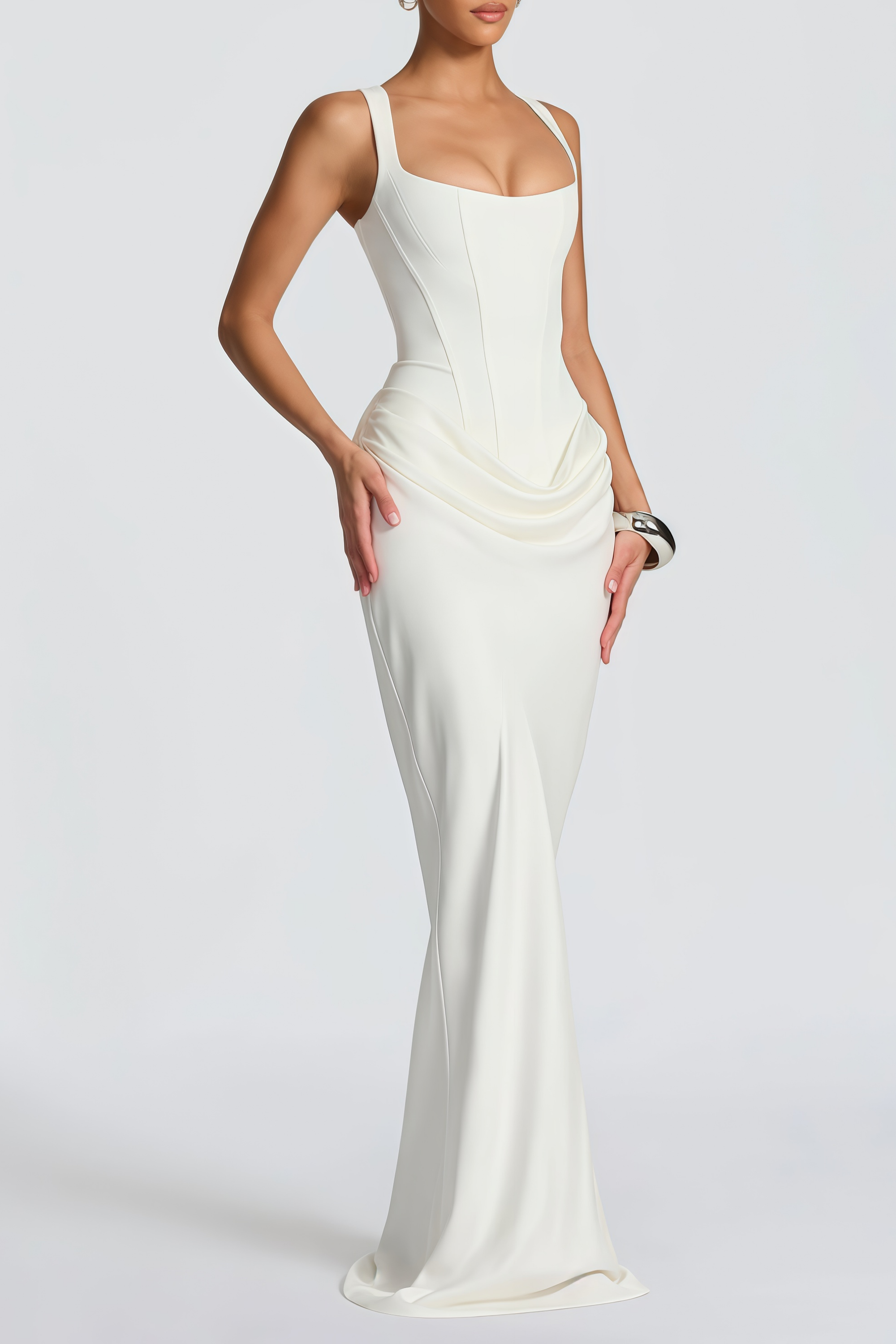 White sleeveless maxi dress with a corset-style bodice and draped hip detailing