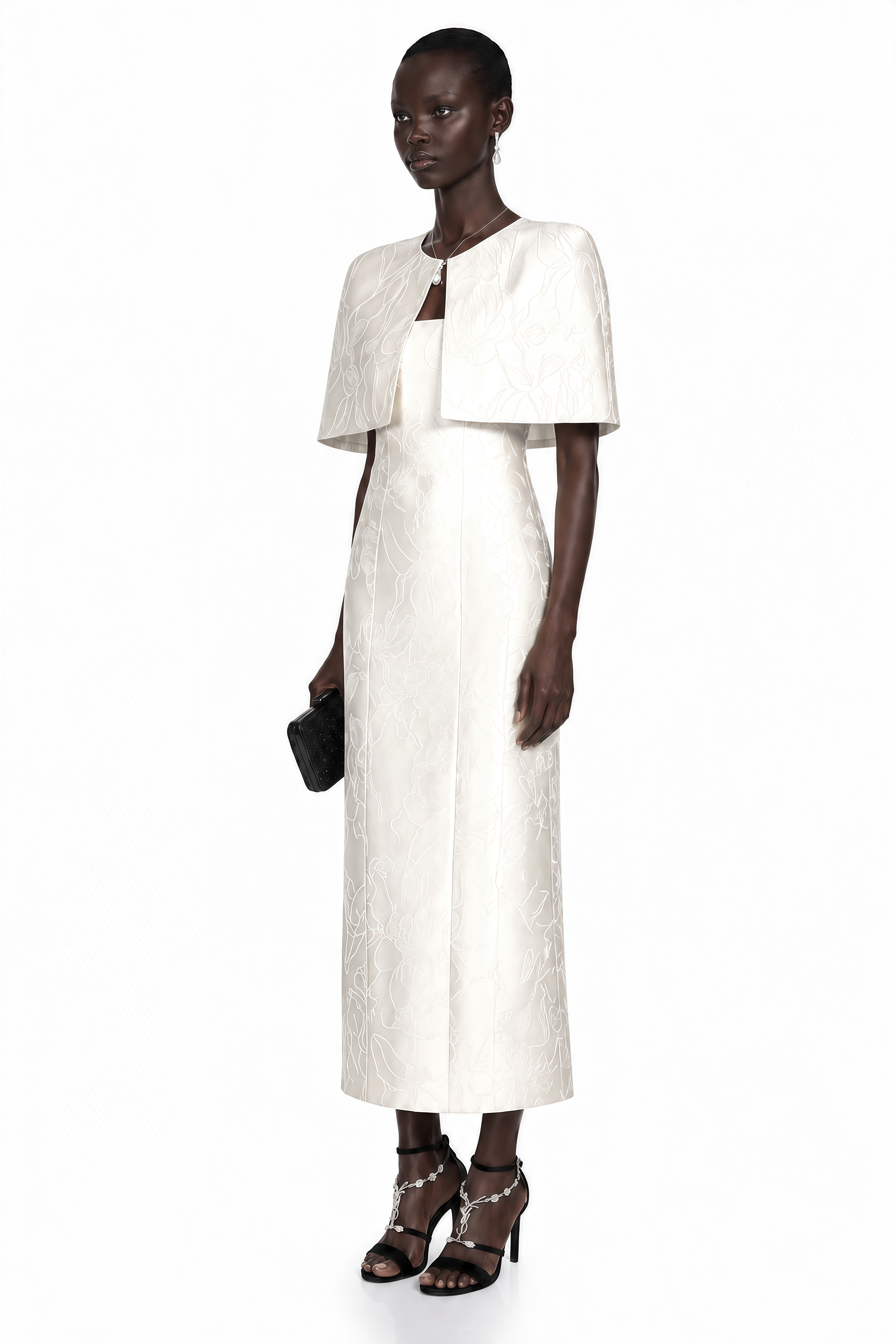 Robe longue droite blanche à imprimé floral jacquard, avec une petite cape ouverte sur le devant assortie