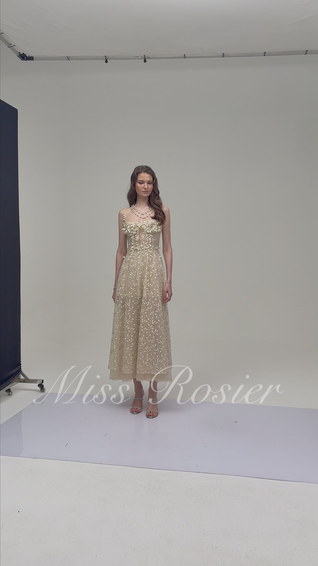 Cream embroidered A-line midi dress with 3D floral details at the neckline