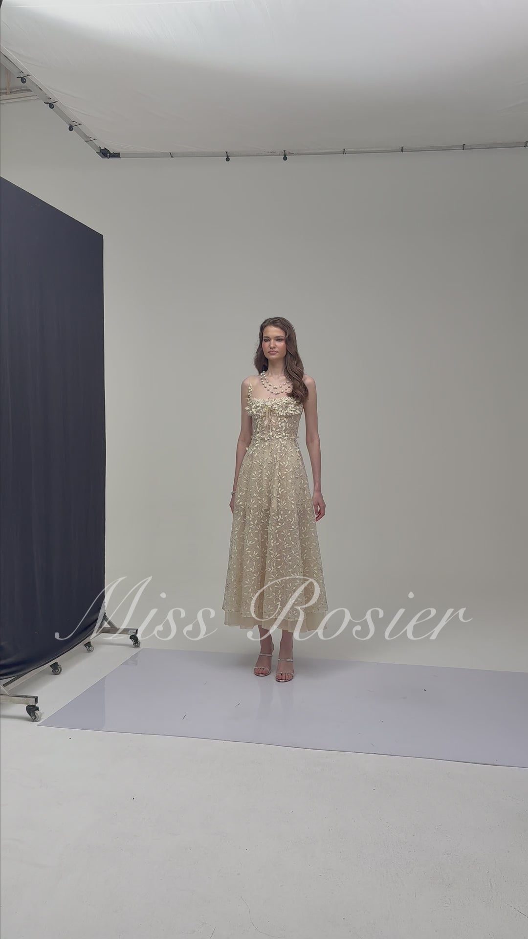 Cream embroidered A-line midi dress with 3D floral details at the neckline