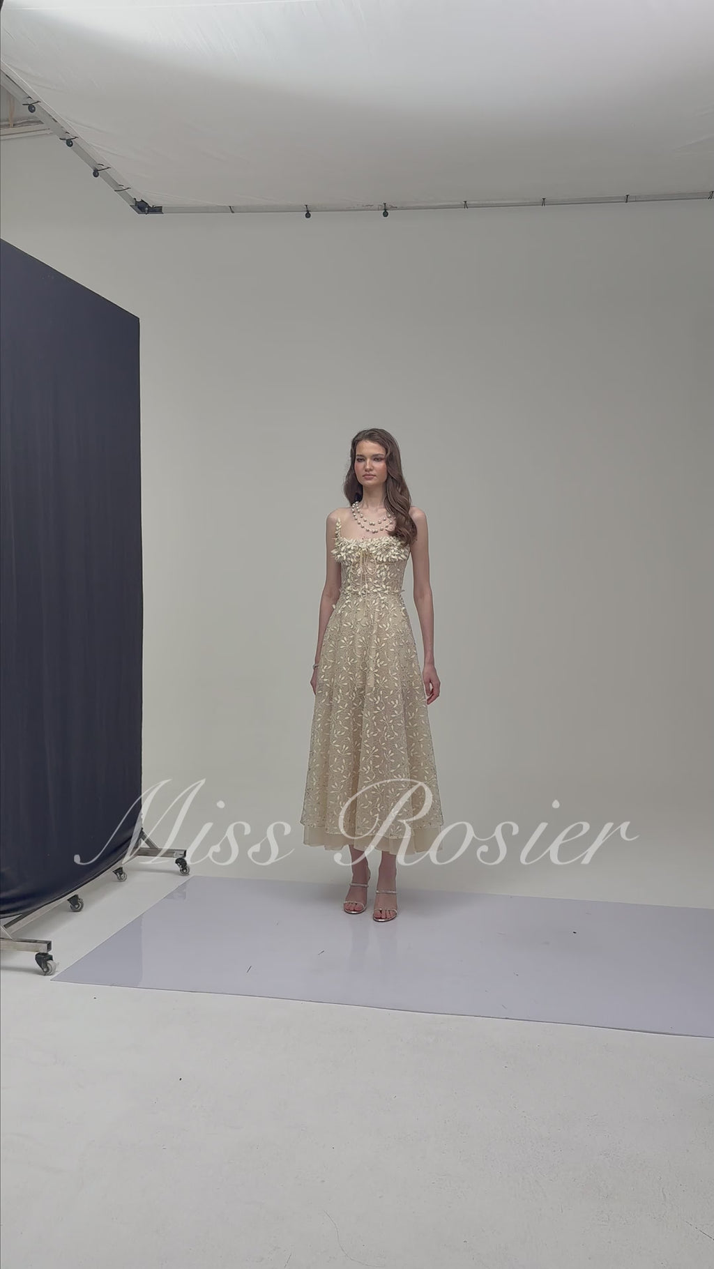 Cream embroidered A-line midi dress with 3D floral details at the neckline